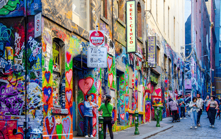 Visitors exploring vibrant street art on Hosier Lane, Melbourne.