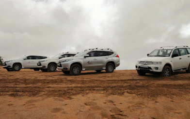 4×4 vehicles on sandy terrain for Agadir Sahara Desert adventure.