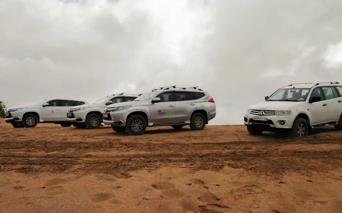 4×4 vehicles on sandy terrain for Agadir Sahara Desert adventure.