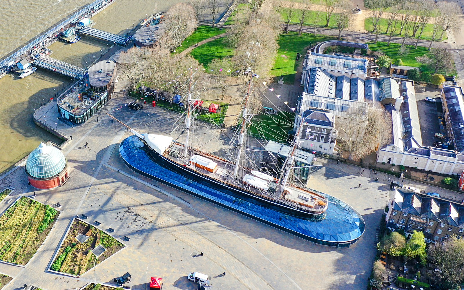 Aerial view of the Cutty Sark ship in Greenwich, London, near the Thames River.