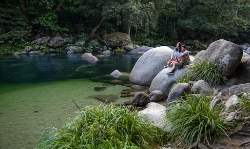 Couple sitting in Mossman Gorge, Daintree Rainforest Tour
