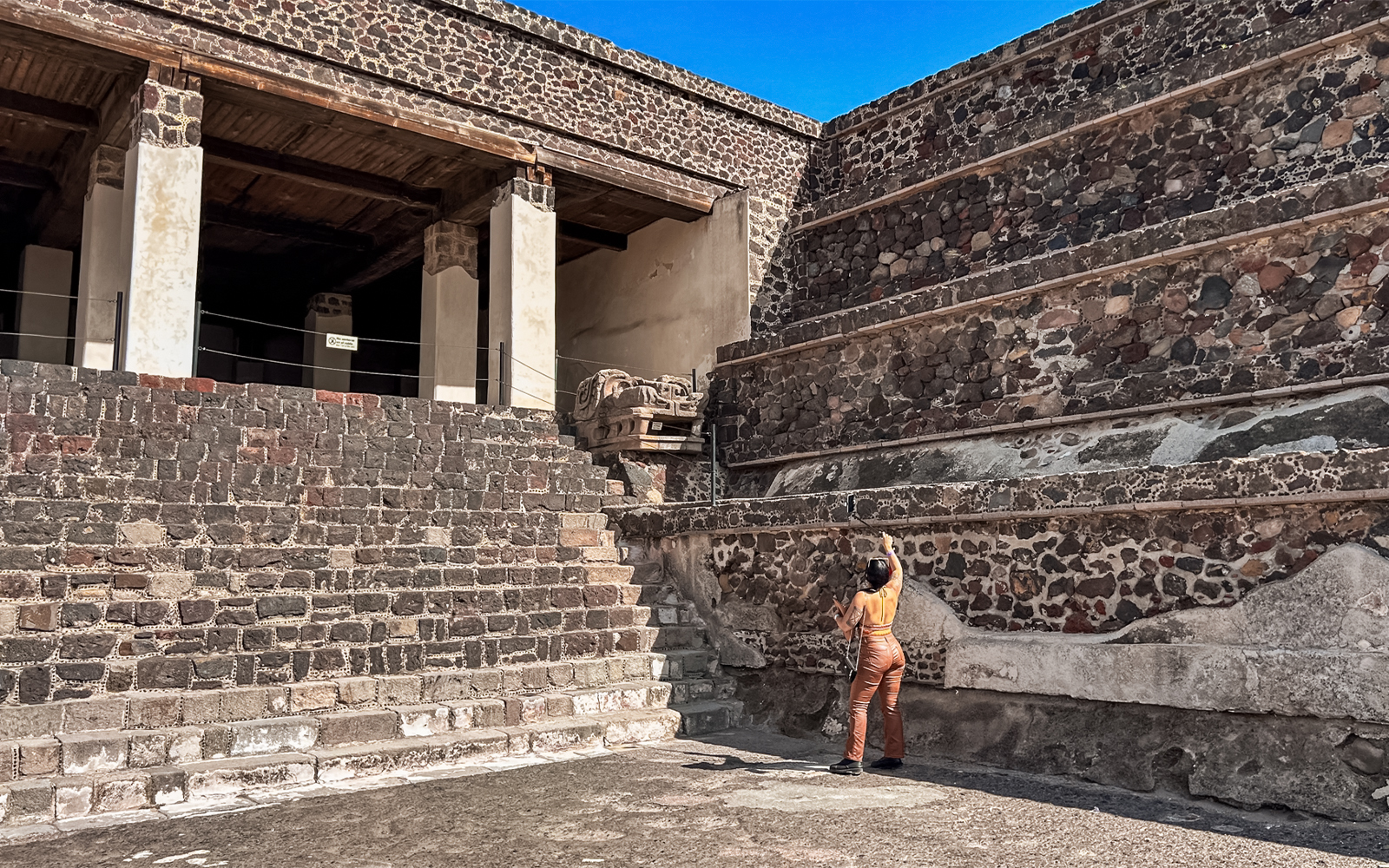 Entrance to the Palace of Quetzalpapalotl with stone walls and columns in Teotihuacan.