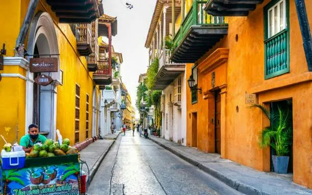 Colorful street in Cartagena with colonial architecture, part of the Lost Emerald Mystery city exploration game.