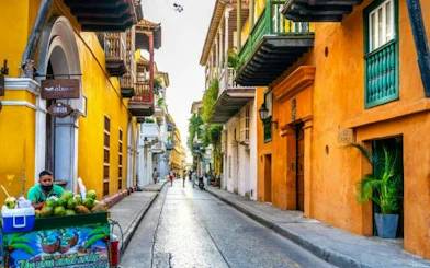 Colorful street in Cartagena with colonial architecture, part of the Lost Emerald Mystery city exploration game.
