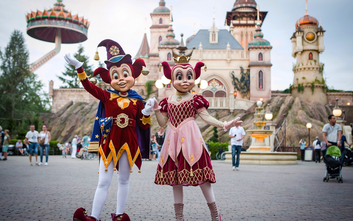 Characters in colorful costumes at Efteling theme park, Netherlands.