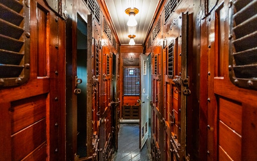 Historic train carriage interior at Pietrarsa Railway Museum, Naples.