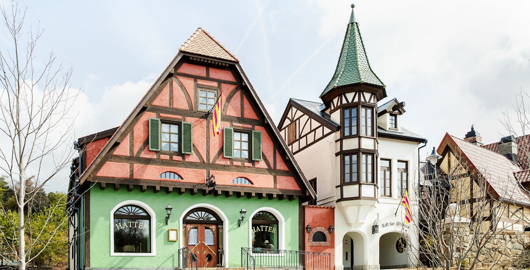 Hatter's Millinery building with colorful facade and tower, ©Studio Ghibli.