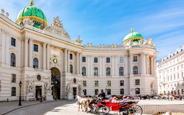 Horse-drawn carriage in front of Hofburg Palace, Vienna, near the Spanish Riding School.