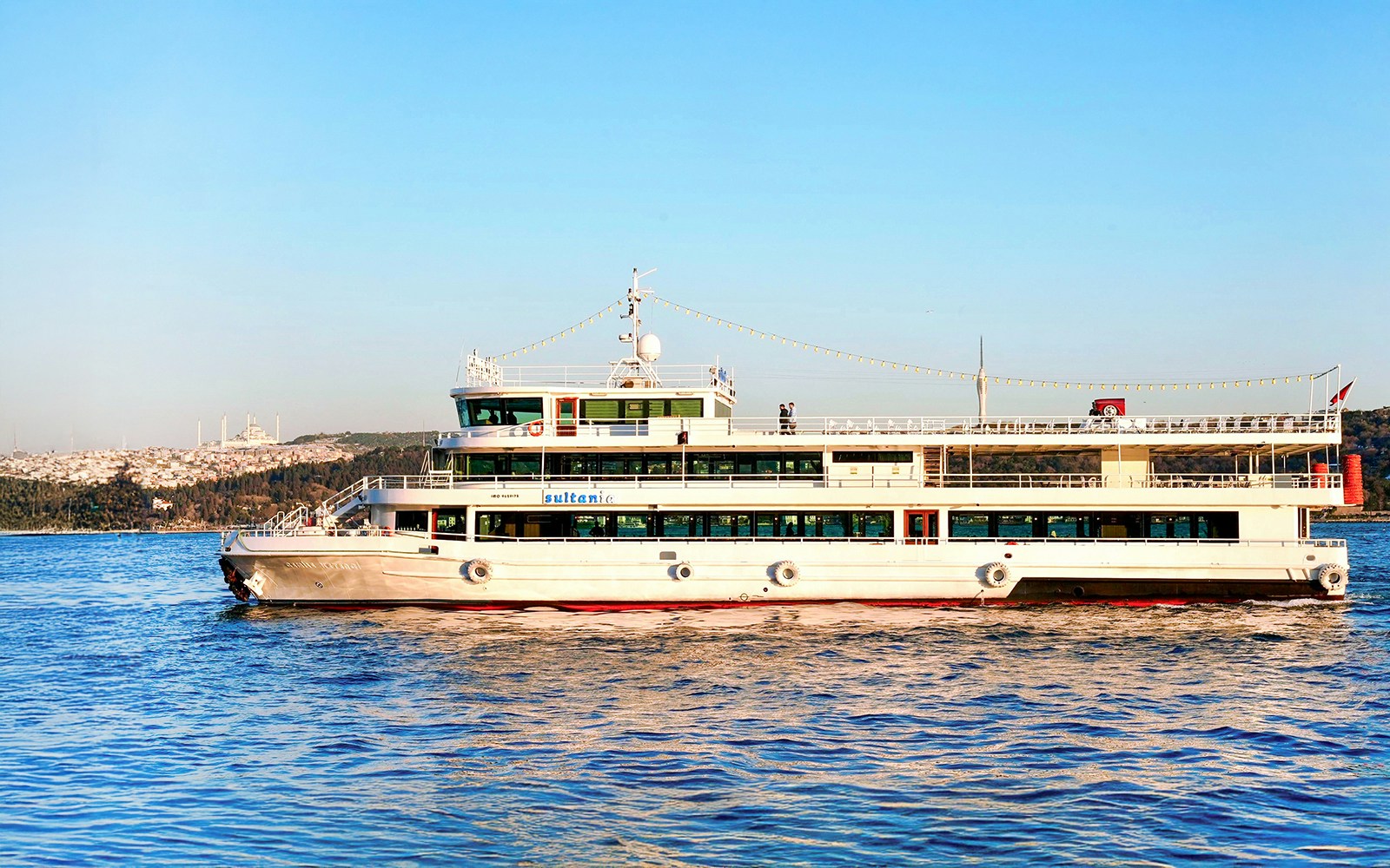 Bosphorus Brunch Cruise on the Bosphorus River, Istanbul, featuring a scenic view of the city skyline.
