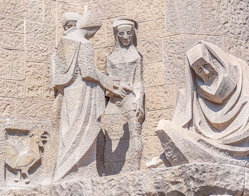 Sagrada Familia Passion Facade sculptures in Barcelona, Spain, showcasing intricate biblical scenes.