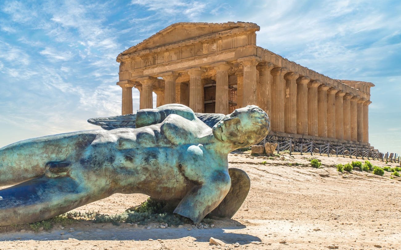 Ancient temple and fallen statue at Valley of Temples, Agrigento, Sicily.