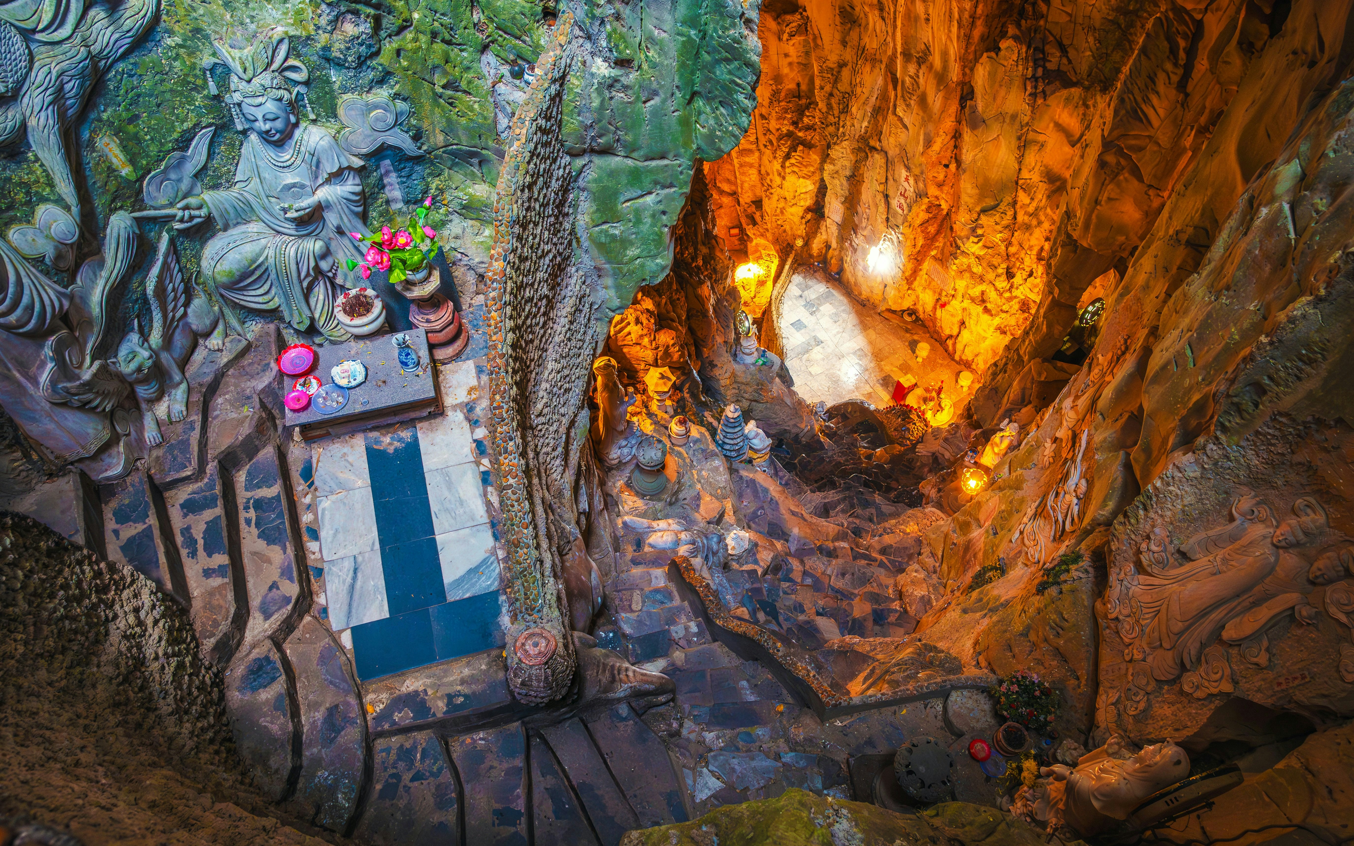Interior view of Am Phu Cave with stone carvings and altar, Marble Mountains, Đà Nẵng, Vietnam.