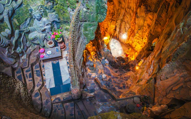 Interior view of Am Phu Cave with stone carvings and altar, Marble Mountains, Đà Nẵng, Vietnam.