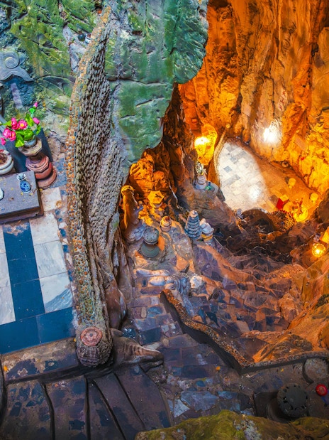 Interior view of Am Phu Cave with stone carvings and altar, Marble Mountains, Đà Nẵng, Vietnam.