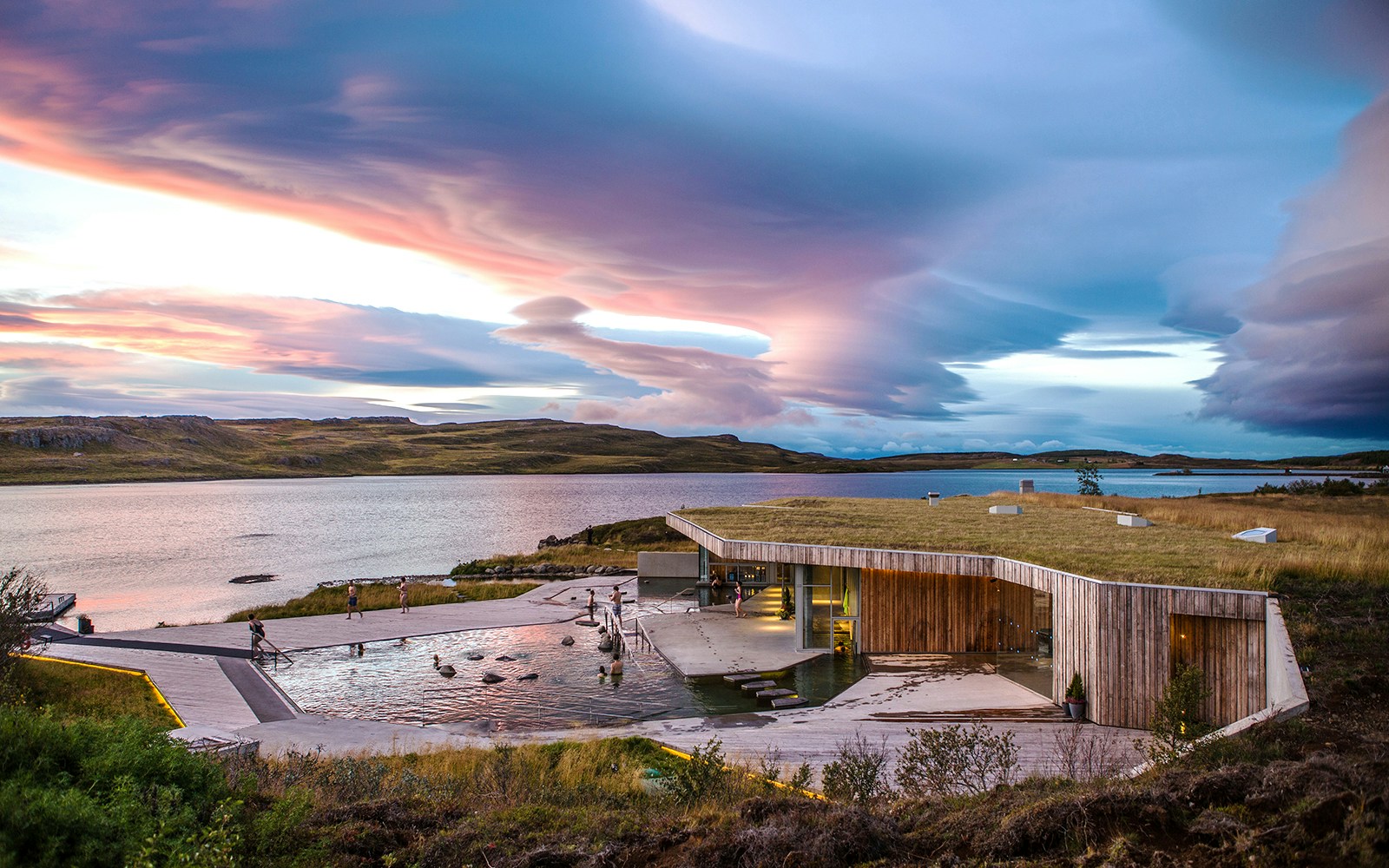 Vok Baths geothermal pools surrounded by lush Icelandic forest.