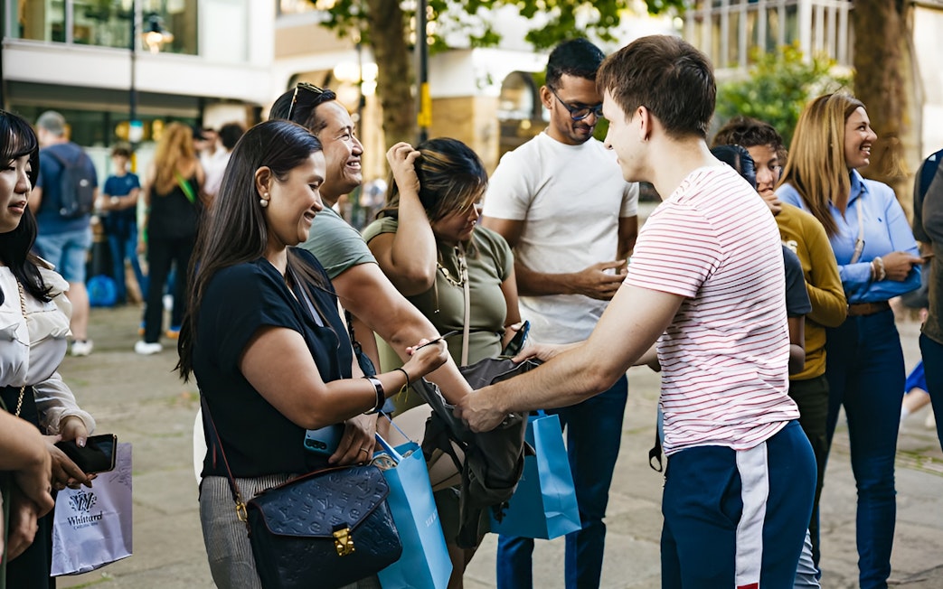 Group of people gathering for a Harry Potter film locations tour in London.