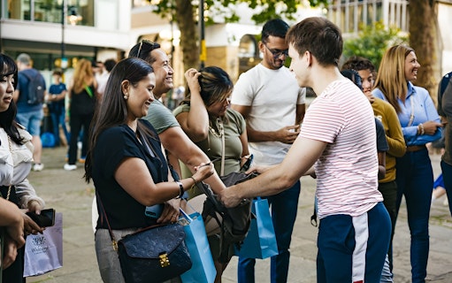 Group of people gathering for a Harry Potter film locations tour in London.