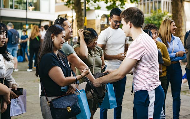 Group of people gathering for a Harry Potter film locations tour in London.