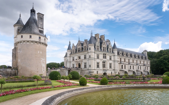 Chenonceau Castle with gardens and moat in Loire Valley, France.