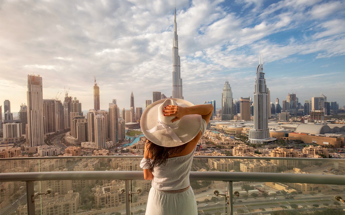 Dubai Downtown skyline with Burj Khalifa and bustling cityscape, highlighting local attractions.