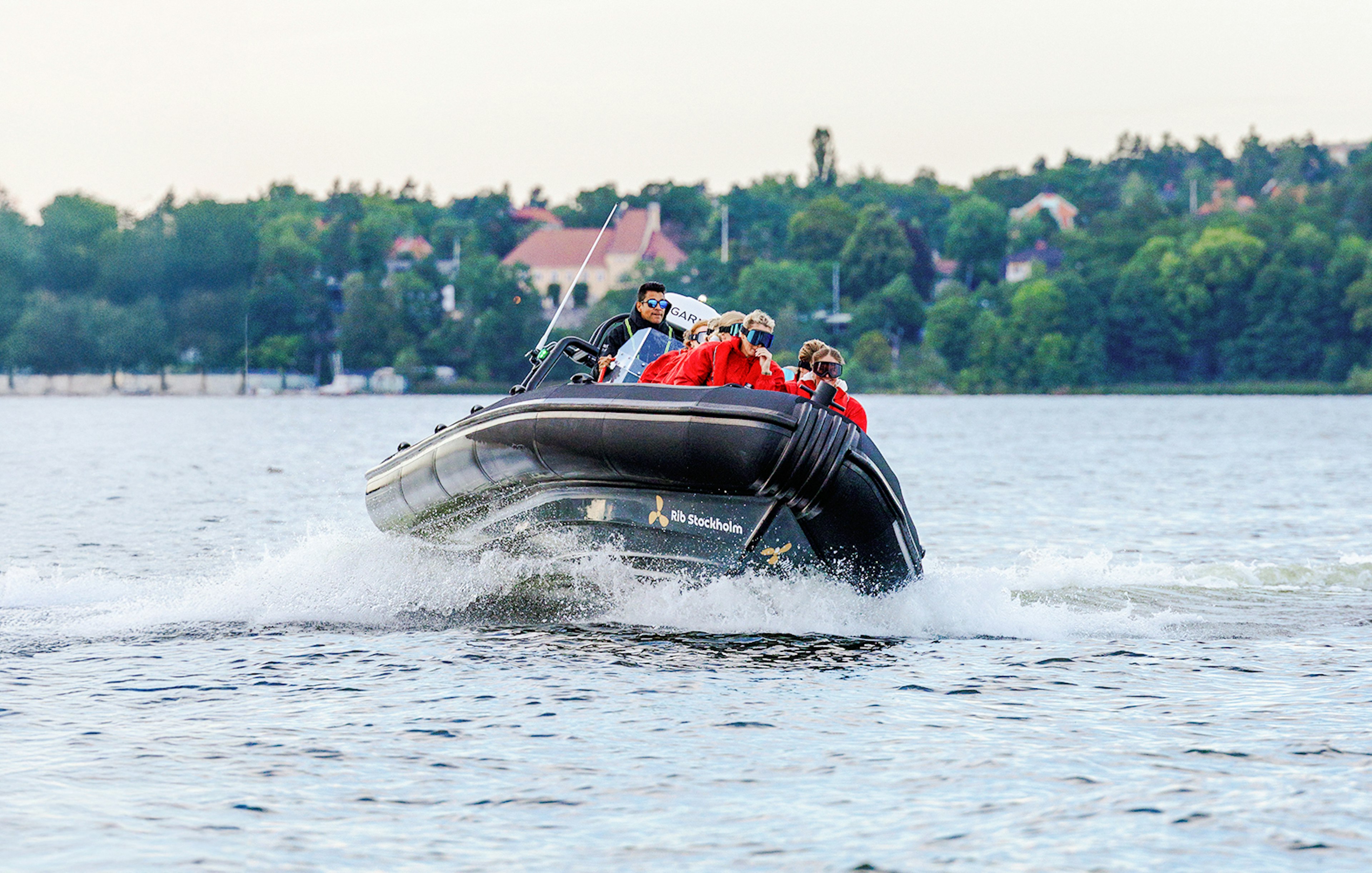 Passengers on a RIB speed boat tour in Stockholm waters.