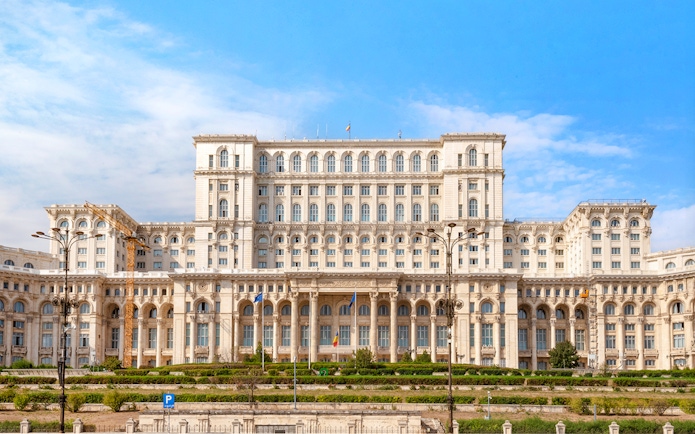 Palace of Parliament exterior in Bucharest, Romania, showcasing grand architecture.