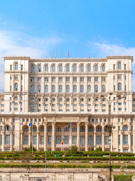 Palace of Parliament exterior in Bucharest, Romania, showcasing grand architecture.