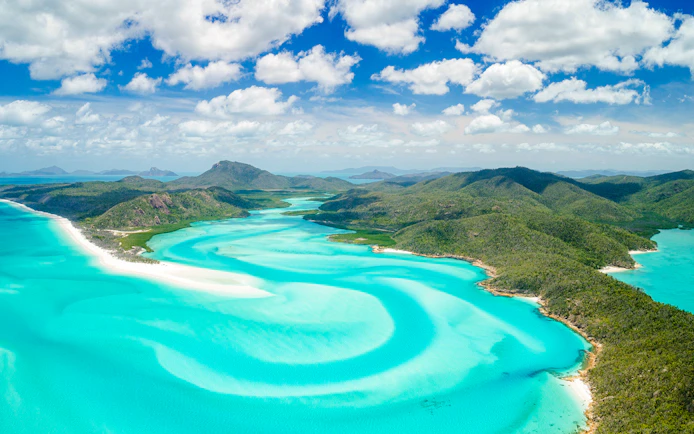 Aerial view of Hill Inlet's turquoise waters and white sands, Whitsundays, Australia.