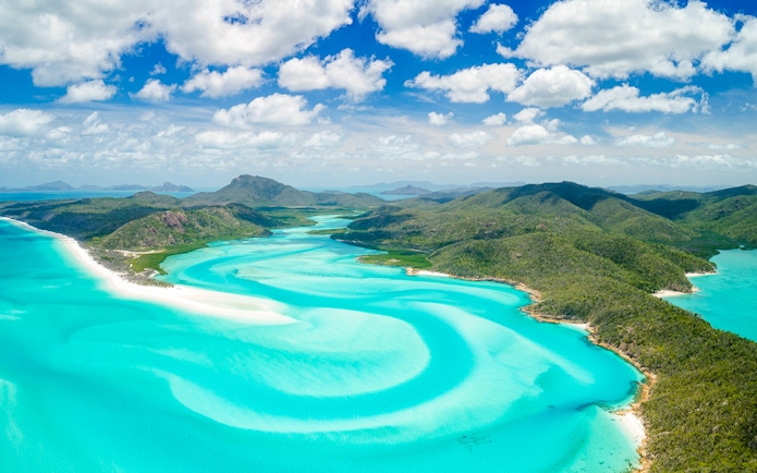 Aerial view of Hill Inlet's turquoise waters and white sands, Whitsundays, Australia.