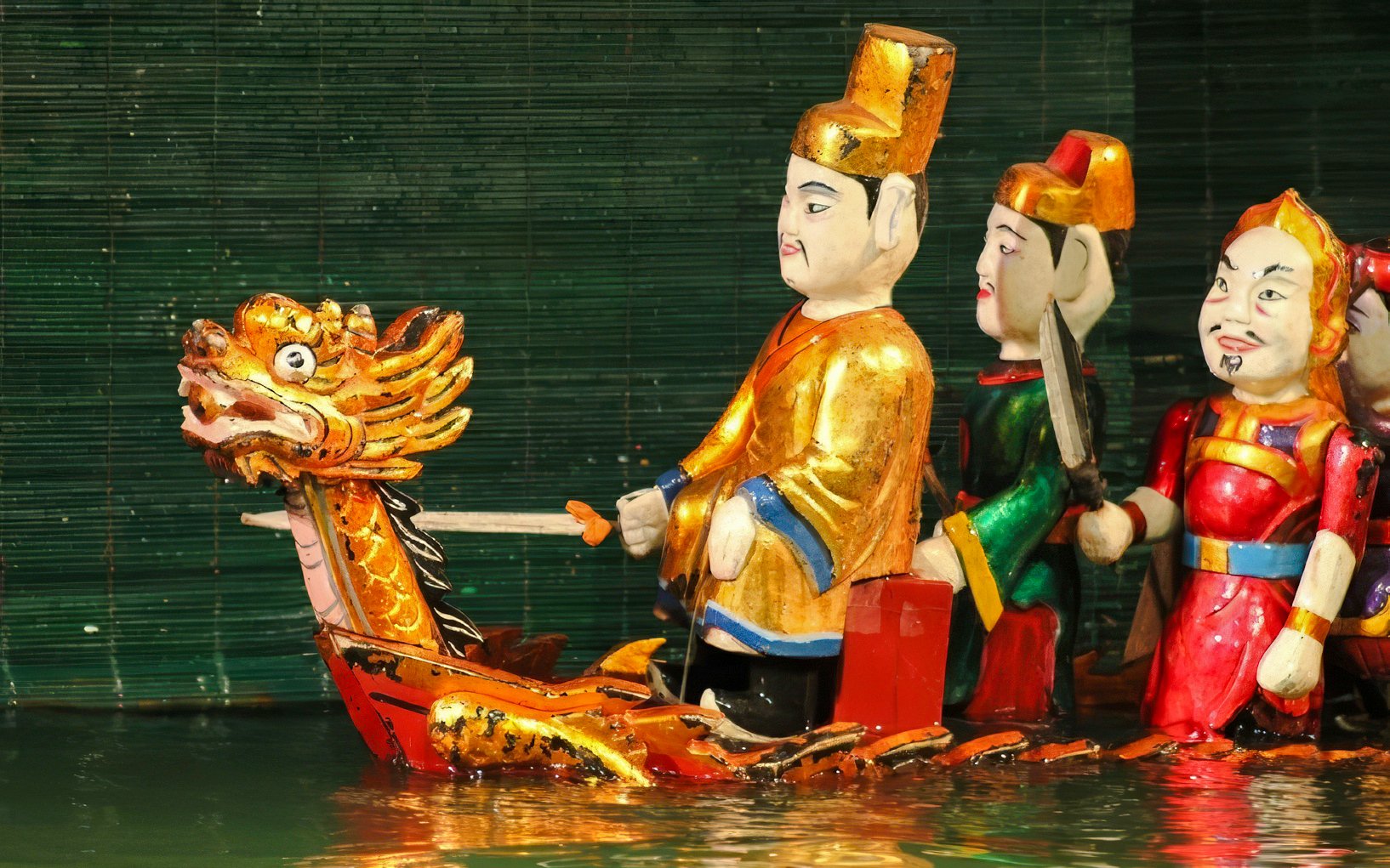 Puppets performing on water at Thang Long Water Puppet Show, Hanoi.
