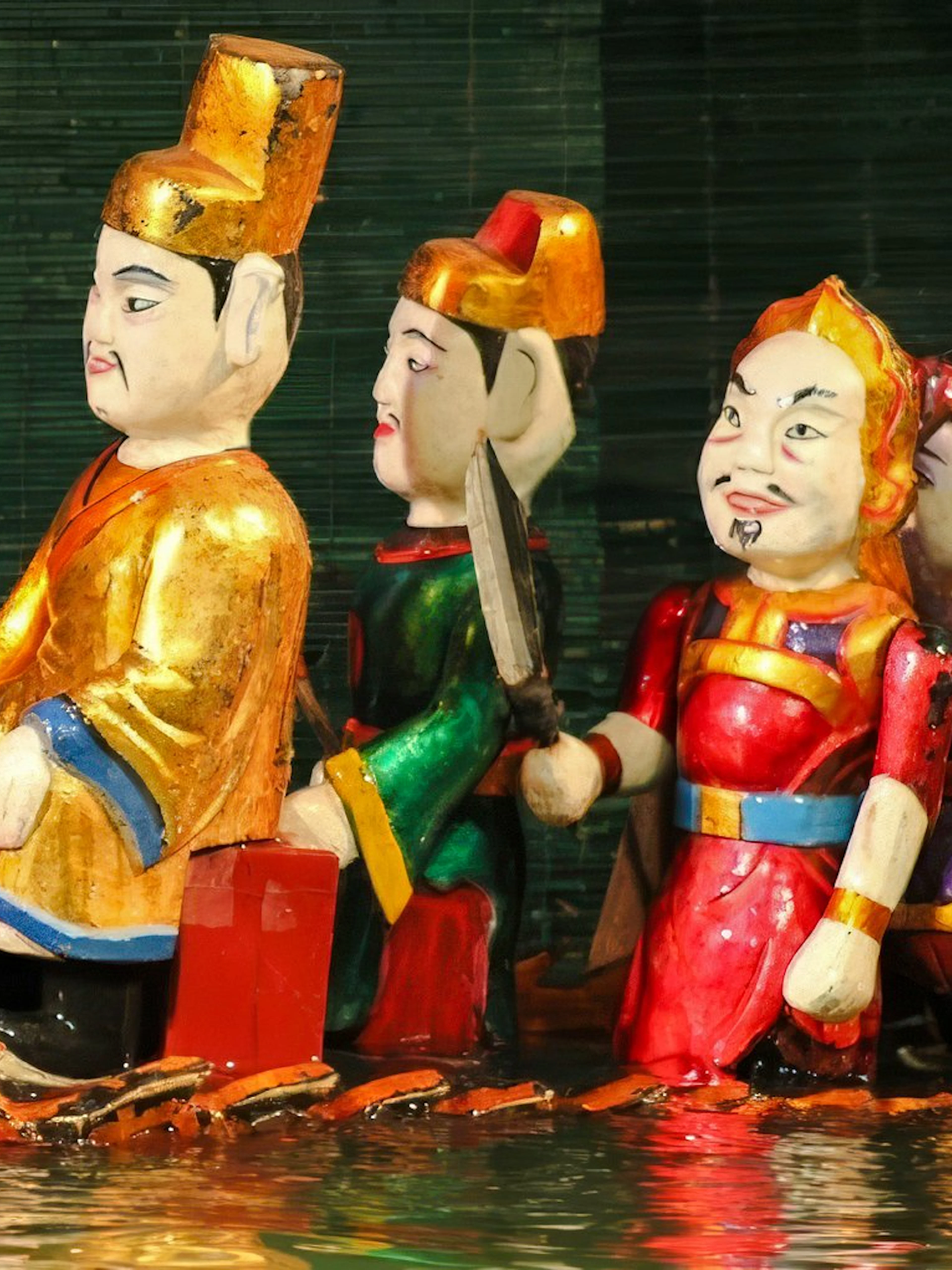 Puppets performing on water at Thang Long Water Puppet Show, Hanoi.