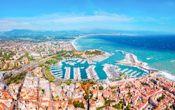 Aerial view of Monaco coastline and marina during a private helicopter tour.