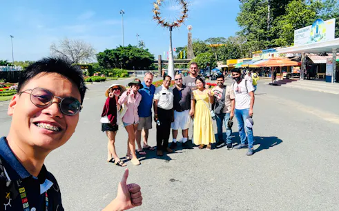 Group of tourists at Black Virgin Mountain entrance, Tay Ninh, near Cao Dai Holy See, Ho Chi Minh City.