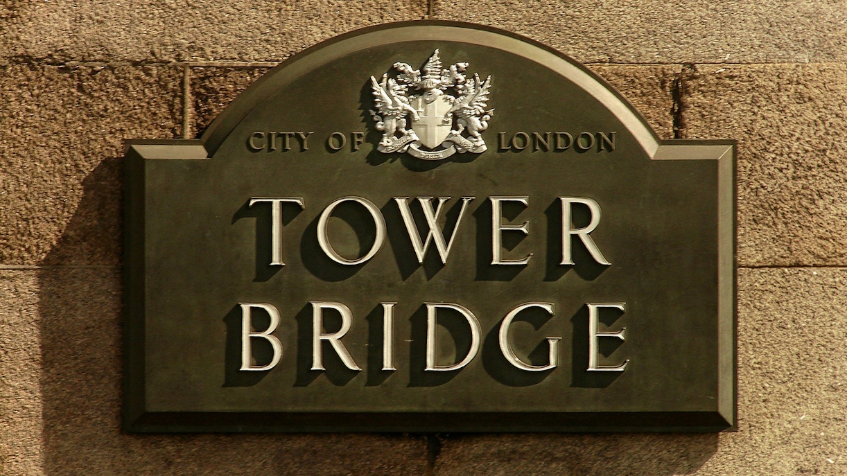 Tower Bridge sign with City of London crest.