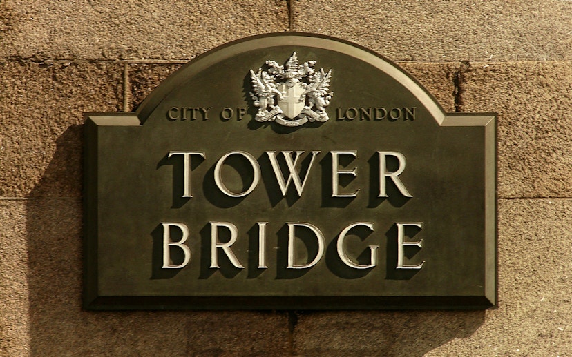 Tower Bridge sign with City of London crest.