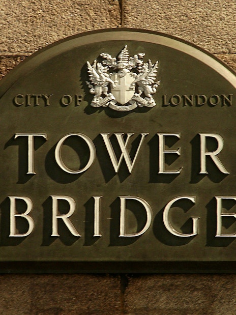 Tower Bridge sign with City of London crest.
