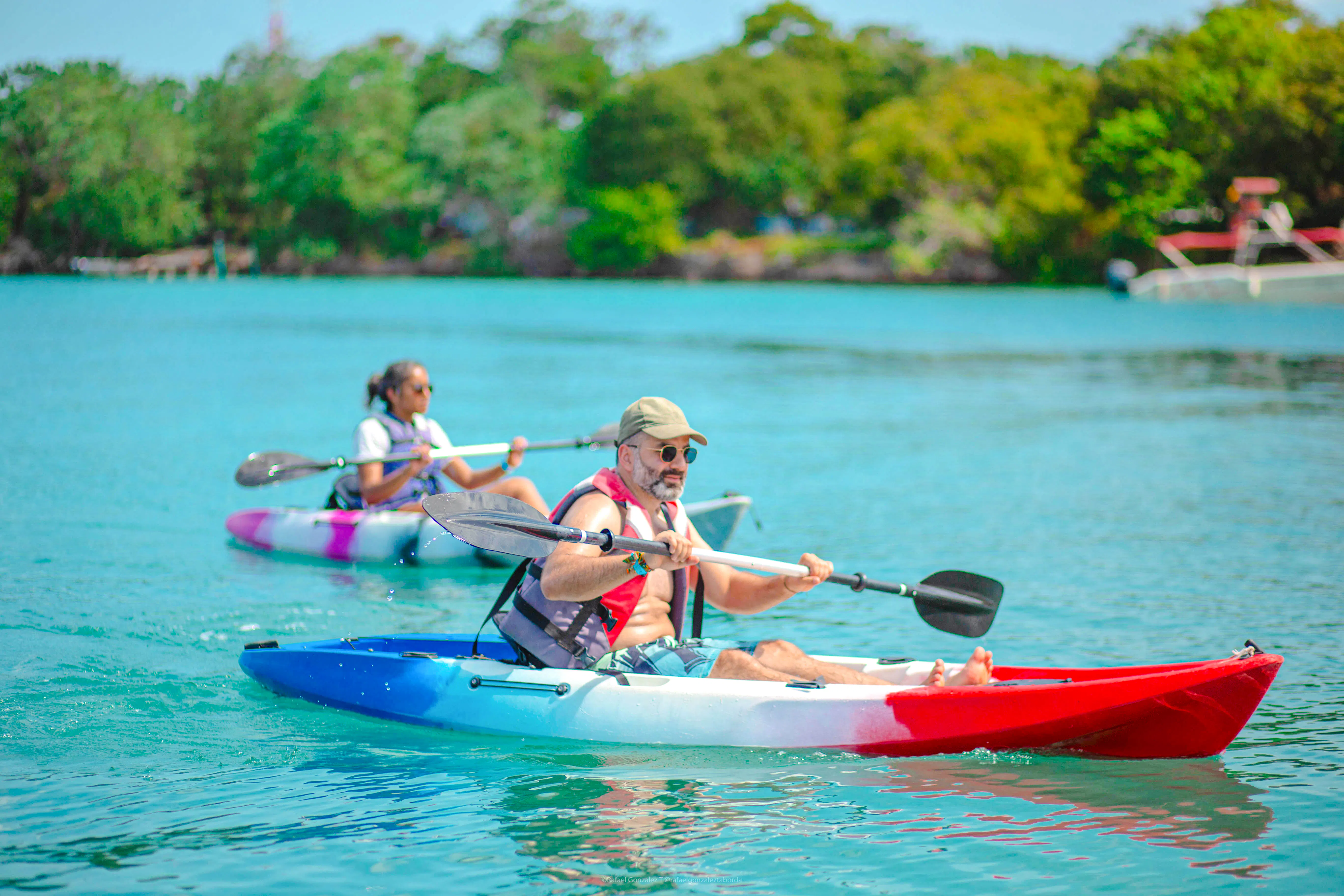 Kayaking in clear waters during 5 Rosario Islands Beaches Day Experience, Cartagena.