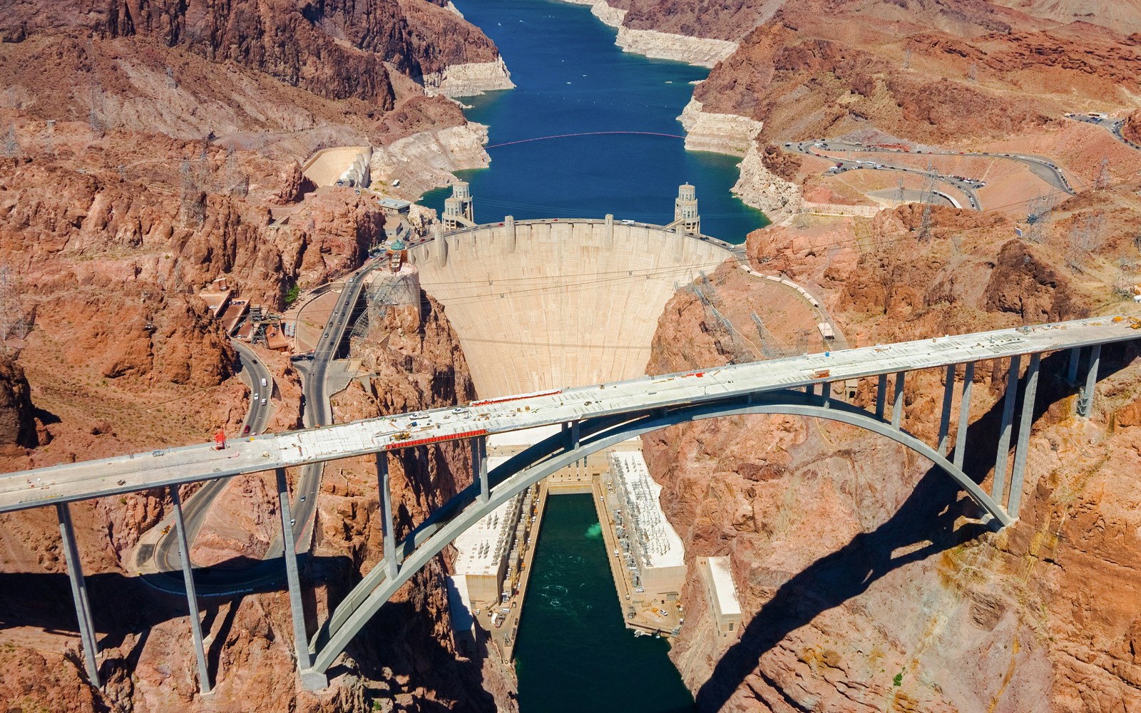 Aerial view of Hoover Dam and Colorado River Bridge from helicopter tour.