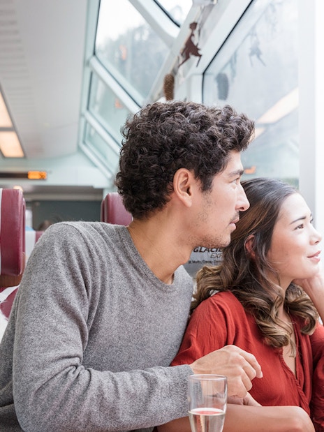 Passengers enjoying scenic views on the Glacier Express, Interrail Switzerland.