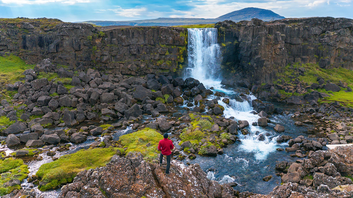 Oxararfoss Waterfall cascading over rocky cliffs in Thingvellir National Park, Iceland.