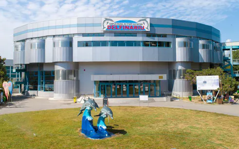 Dolphinarium entrance with dolphin sculptures in Constanta, Romania.