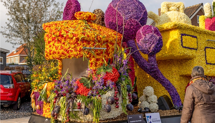 Flowers floats at evening Flower Parade Bollenstreek, Noordwijkerhout, illuminated for night display.