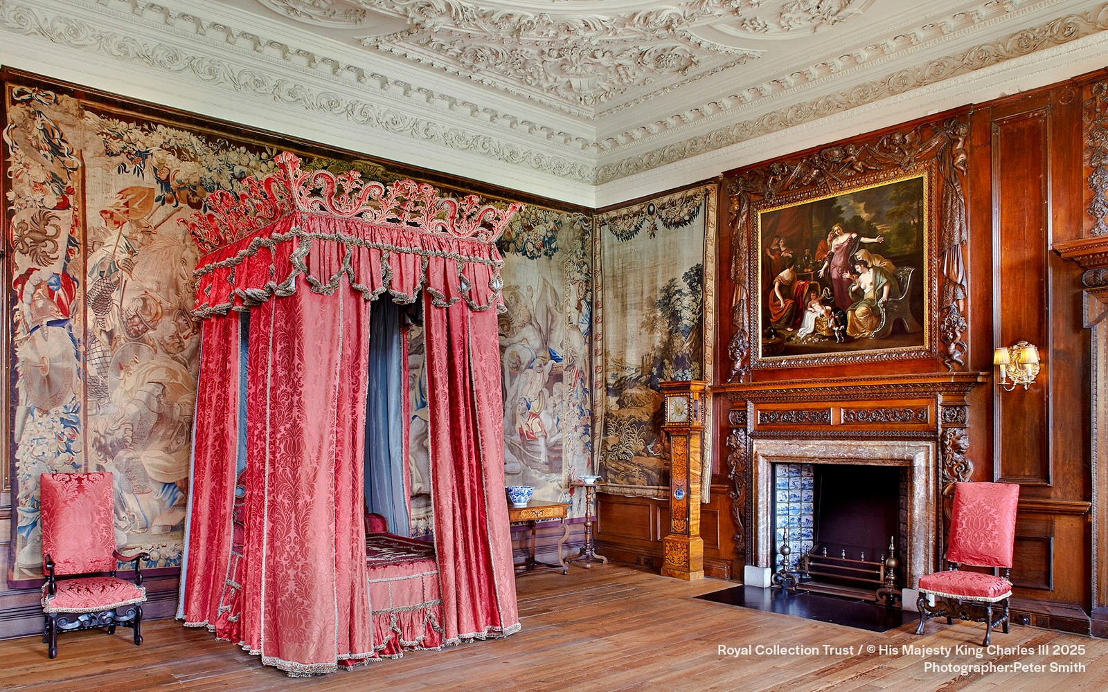 Kings Bedchamber with ornate canopy bed and tapestries at the Palace of Holyroodhouse.
