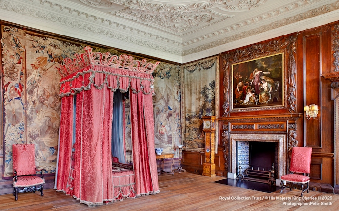 Kings Bedchamber with ornate canopy bed and tapestries at the Palace of Holyroodhouse.