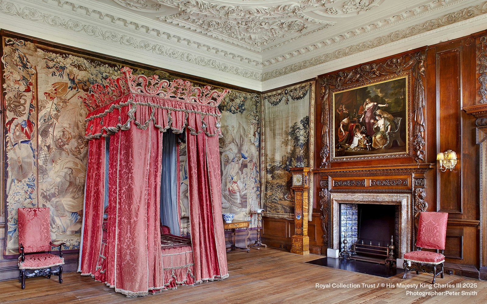 Kings Bedchamber with ornate canopy bed and tapestries at the Palace of Holyroodhouse.