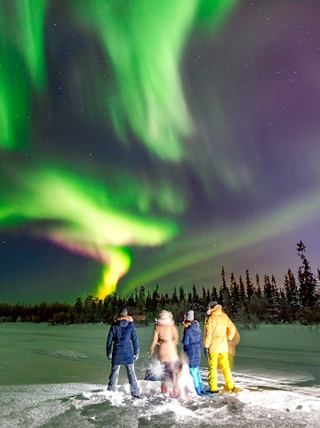 Group watching Northern Lights in Reykjavik, Iceland.