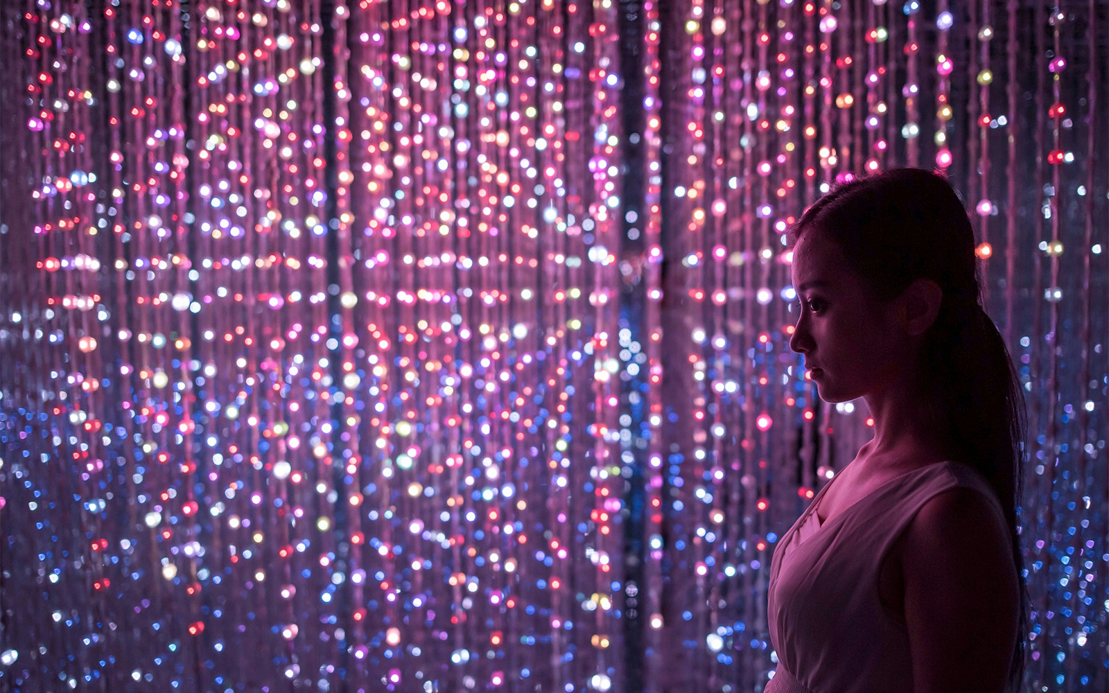 TeamLab Planets Exhibits immersive digital art installation in Tokyo, featuring vibrant light displays.