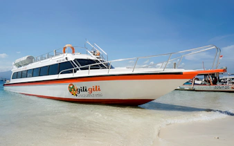 Fast boat docked on sandy beach for Bali, Nusa Penida, Gili Islands, Lombok route.