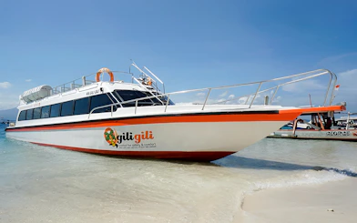 Fast boat docked on sandy beach for Bali, Nusa Penida, Gili Islands, Lombok route.