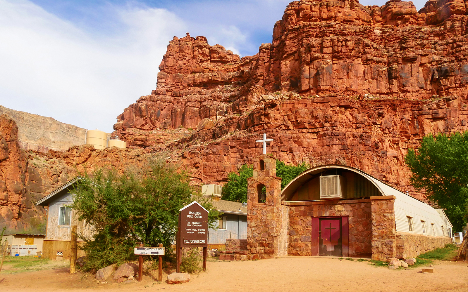 Church in Supai Village, Havasupai Indian Reservation, Arizona, surrounded by red rock formations.